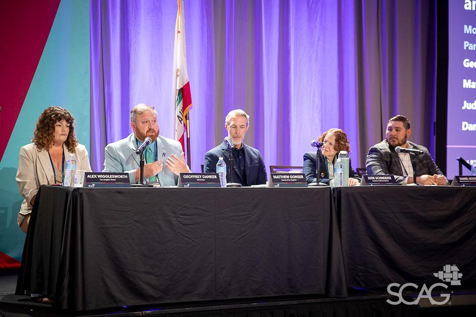 Panelists seated at a table with microphones, purple backdrop, SCAG logo visible.