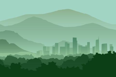 City skyline with layered green mountains.